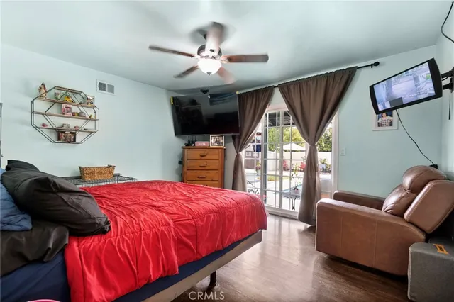 a bedroom with bed and a couch