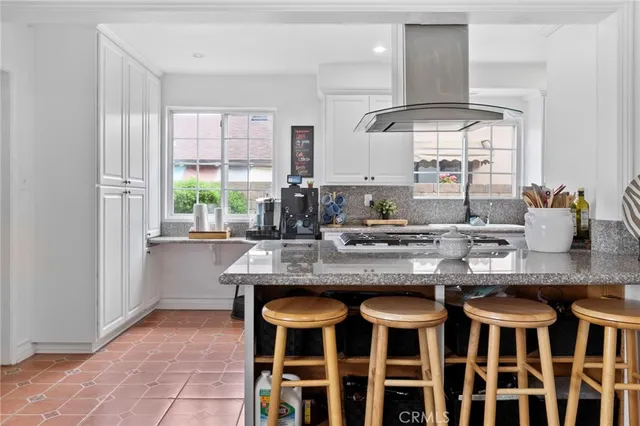 a kitchen with a table and chairs