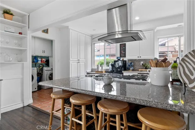 a kitchen with granite countertop lots of counter top space and dining table