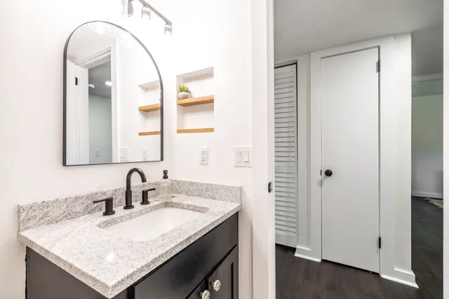 a bathroom with a sink and a mirror