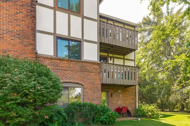 a front view of a building with garden