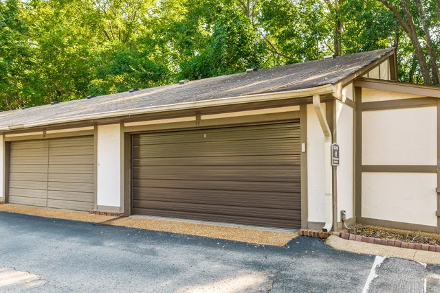 a side view of a house with a garage