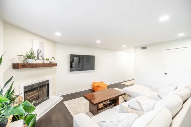 a living room with furniture and a fireplace
