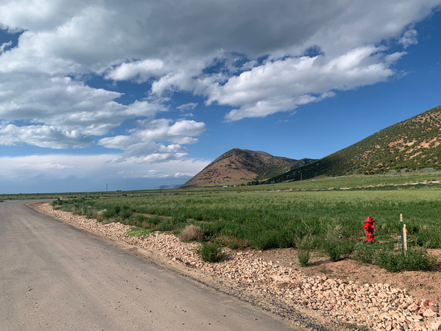 1502 East Eden Ranch Road, Unit 33 Laketown, UT 84038 - Photo 2 of 12 View of mountain background featuring rural landscape