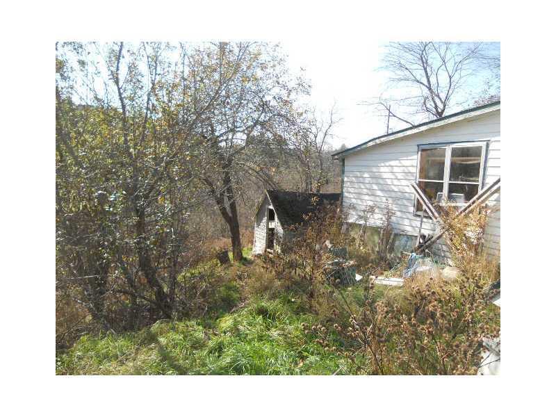 94 Hatch Road Prospect, ME 04981 - Photo 7 of 17 Exterior Back. land goes down hill...