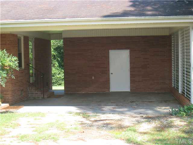 334 Dixon Road Coats, NC 27521 - Photo 3 of 13 View of the carport showing nice storage area.