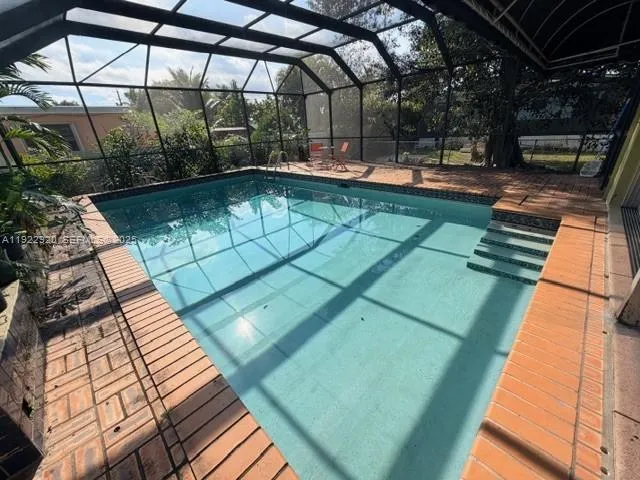 a view of a backyard with sitting area
