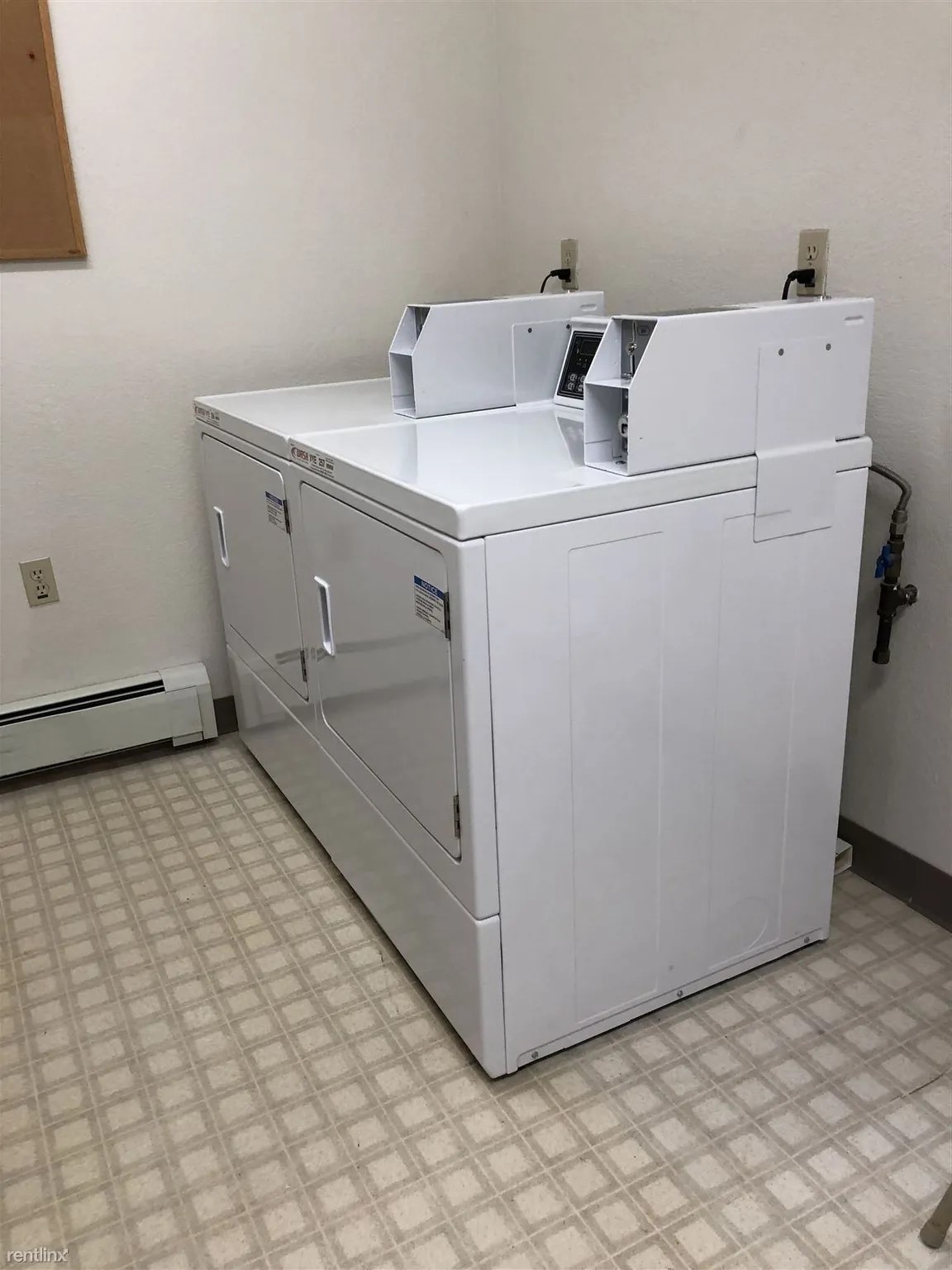 1108 South Huron Street Cheboygan, MI 49721 - Photo 2 of 6 a utility room with dryer and washer