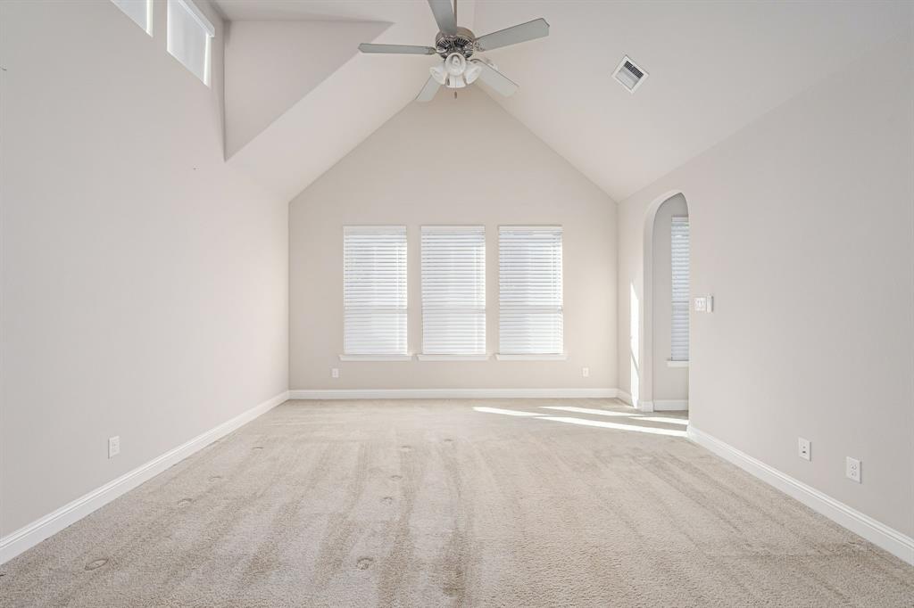 1506 Mariners Hope Way Wylie, TX 75098 - Photo 16 of 28 an empty room with windows and fan
