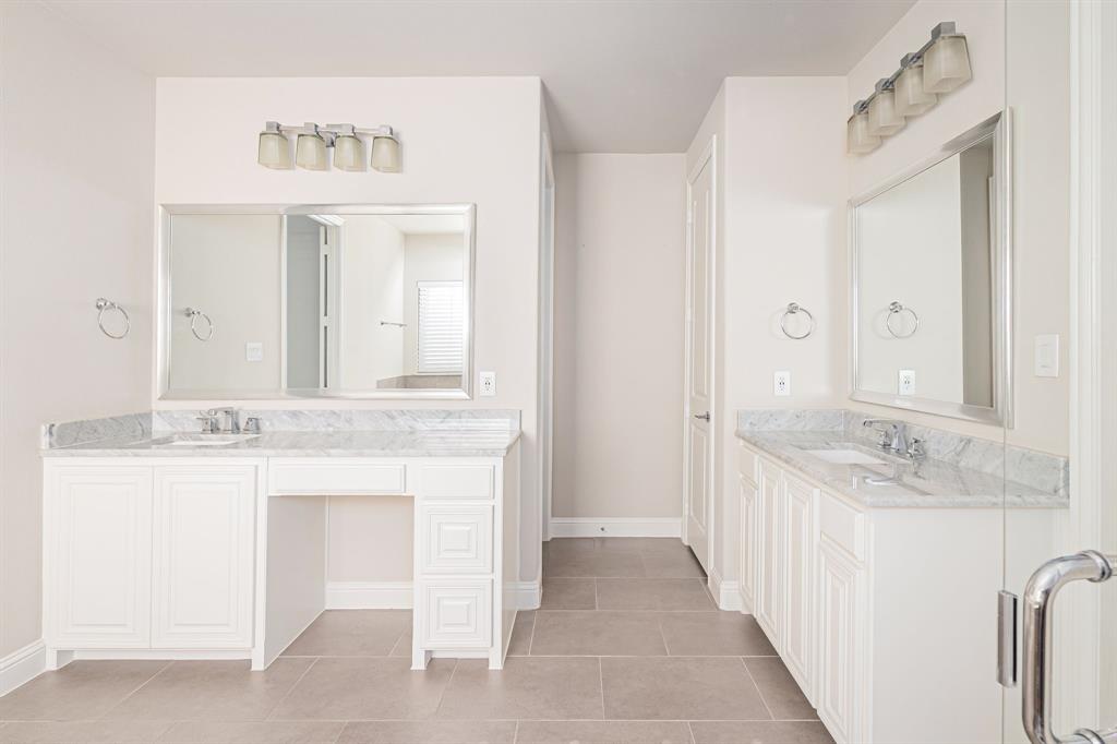 1506 Mariners Hope Way Wylie, TX 75098 - Photo 17 of 28 a bathroom with a sink a mirror and a vanity