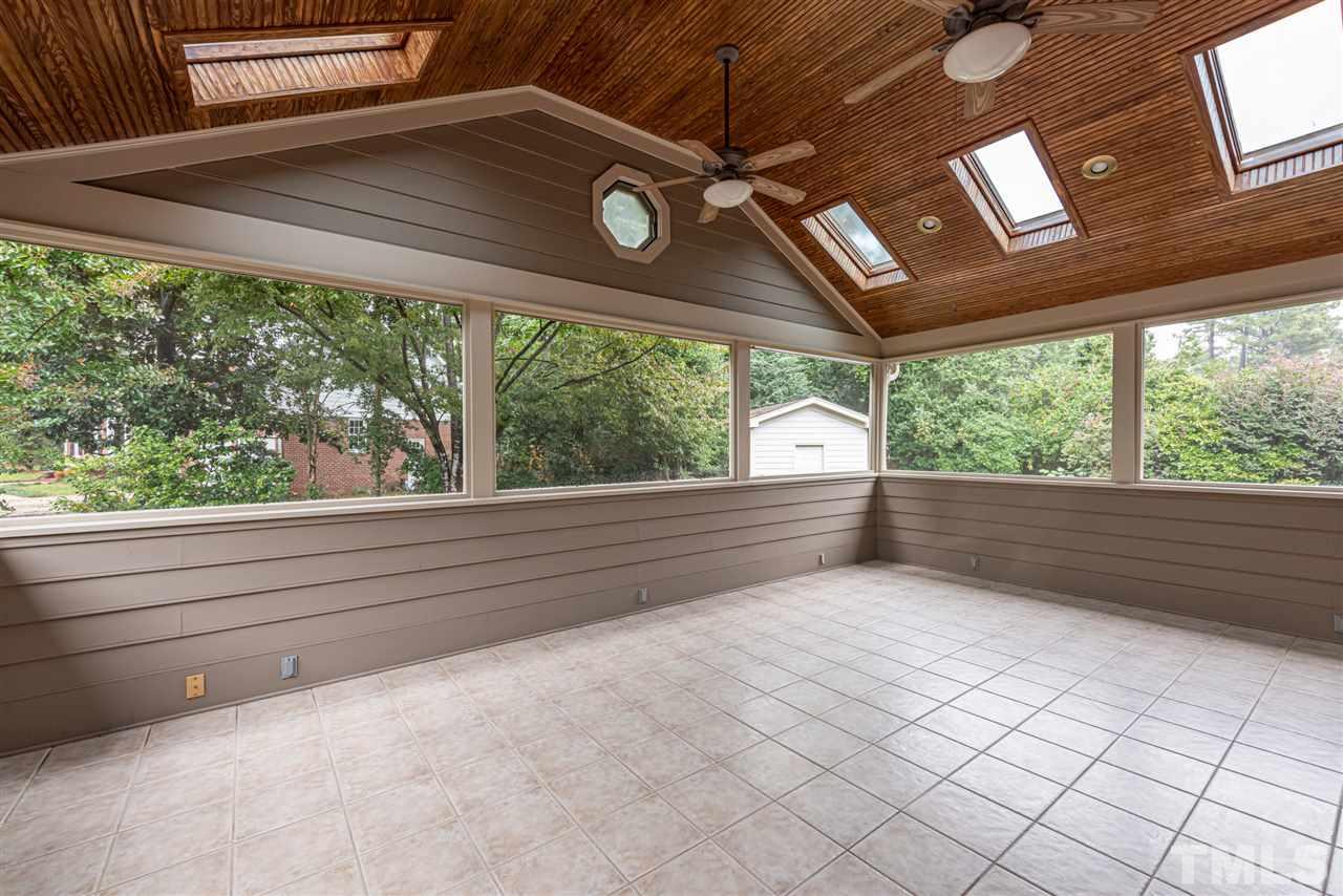 1701 Pony Run Road Raleigh, NC 27615 - Photo 23 of 30 Amazing Screened Porch with lots of charm - vaulted ceiling and two fans.