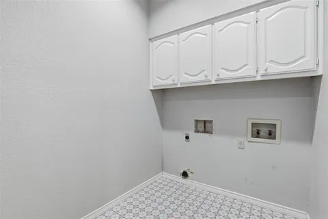 a bathroom with a sink and cabinets