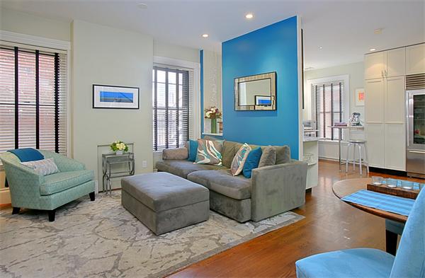 15 Warren Avenue, Unit 7 Boston, MA 02116 - Photo 1 of 9 a living room with furniture and a window