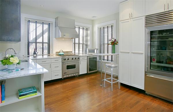 15 Warren Avenue, Unit 7 Boston, MA 02116 - Photo 2 of 9 a kitchen with a sink stove and cabinets