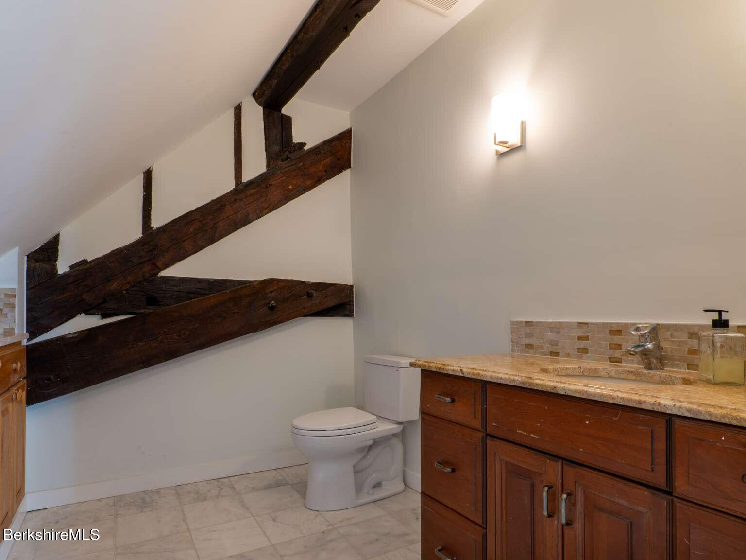 160 High Street Lee, MA 01238 - Photo 26 of 41 a bathroom with a toilet sink and mirror