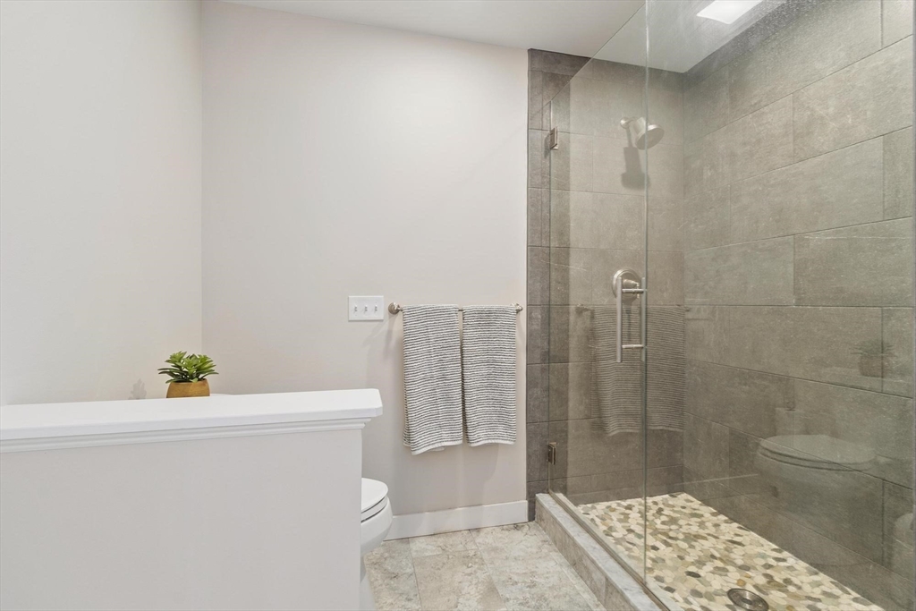 3 Swett Drive Hampton, NH 03842 - Photo 11 of 42 a bathroom with a sink a toilet and shower