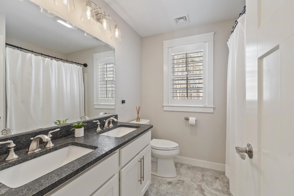 3 Swett Drive Hampton, NH 03842 - Photo 13 of 42 a bathroom with double sink and a mirror