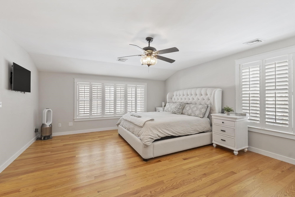 3 Swett Drive Hampton, NH 03842 - Photo 19 of 42 a spacious bedroom with a bed and a window