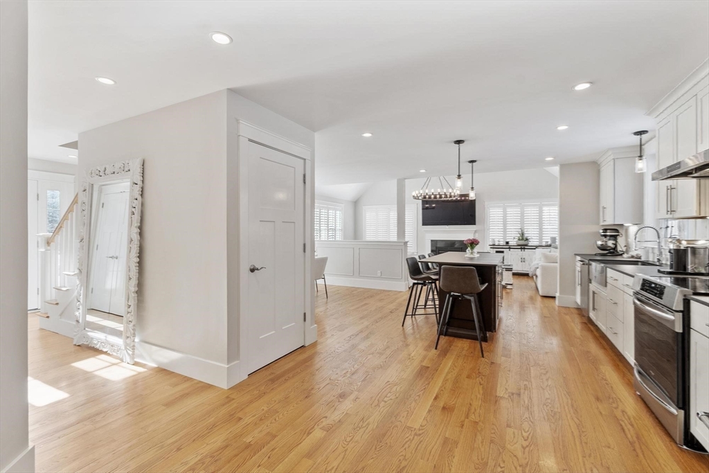 3 Swett Drive Hampton, NH 03842 - Photo 25 of 42 an open kitchen with wooden floor and stainless steel appliances
