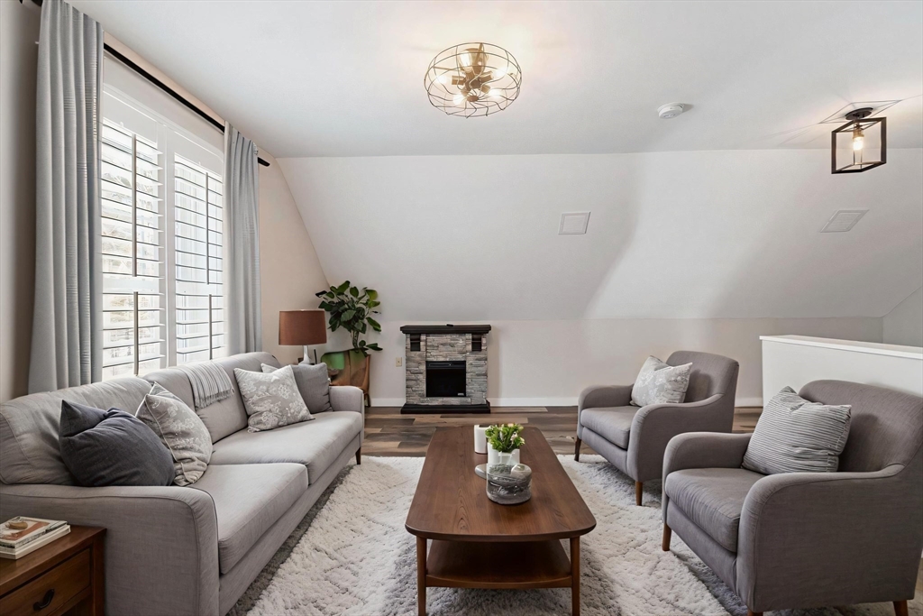 3 Swett Drive Hampton, NH 03842 - Photo 26 of 42 a living room with furniture and a fireplace