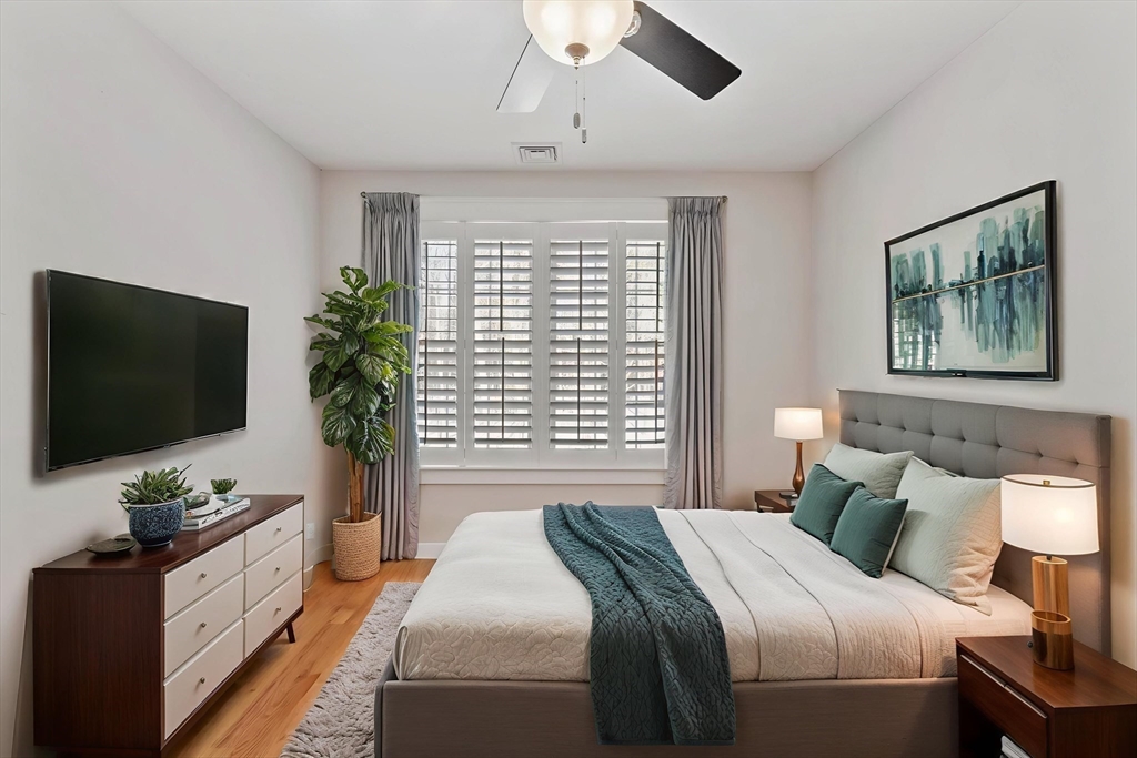 3 Swett Drive Hampton, NH 03842 - Photo 29 of 42 a bedroom with a large bed and a flat screen tv