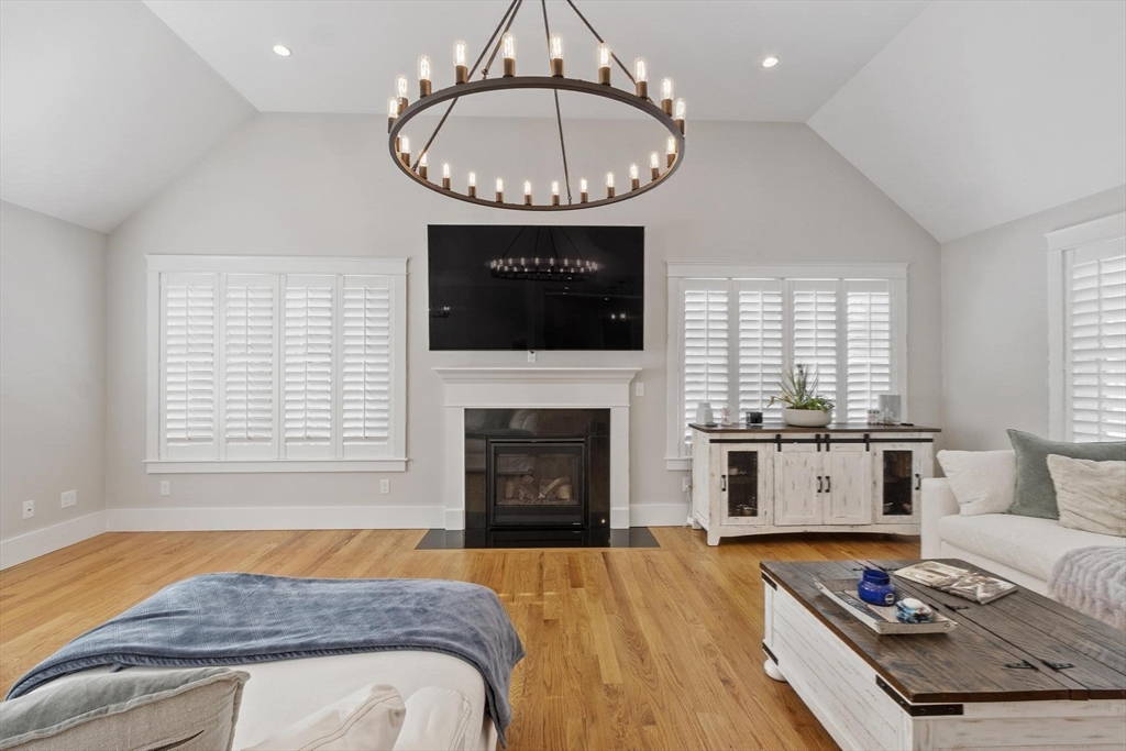 3 Swett Drive Hampton, NH 03842 - Photo 3 of 42 a living room with furniture a fireplace and flat screen tv