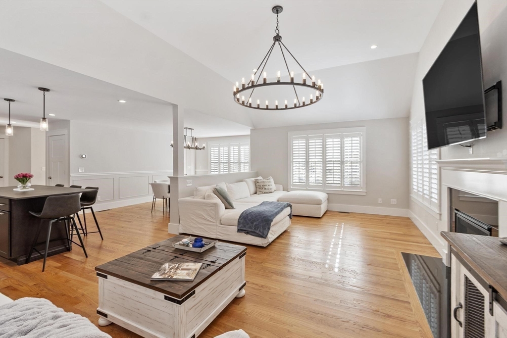 3 Swett Drive Hampton, NH 03842 - Photo 32 of 42 a living room with furniture a flat screen tv and a window