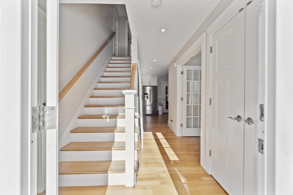 3 Swett Drive Hampton, NH 03842 - Photo 33 of 42 a view of a hallway with wooden floor and entryway