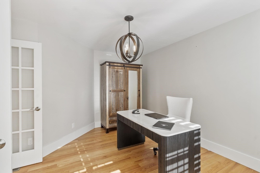 3 Swett Drive Hampton, NH 03842 - Photo 35 of 42 a view of a room with wooden floor a cabinet and a window