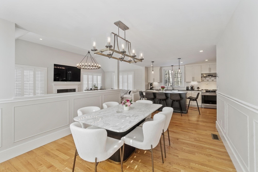 3 Swett Drive Hampton, NH 03842 - Photo 8 of 42 a view of a dining room with furniture and a chandelier