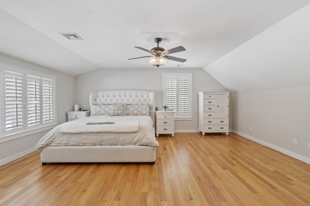 3 Swett Drive Hampton, NH 03842 - Photo 10 of 42 a spacious bedroom with a bed and a ceiling fan