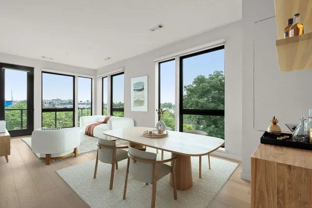 a view of a dining room with furniture window and outside view