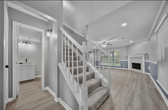 a view of entryway and hall with wooden floor