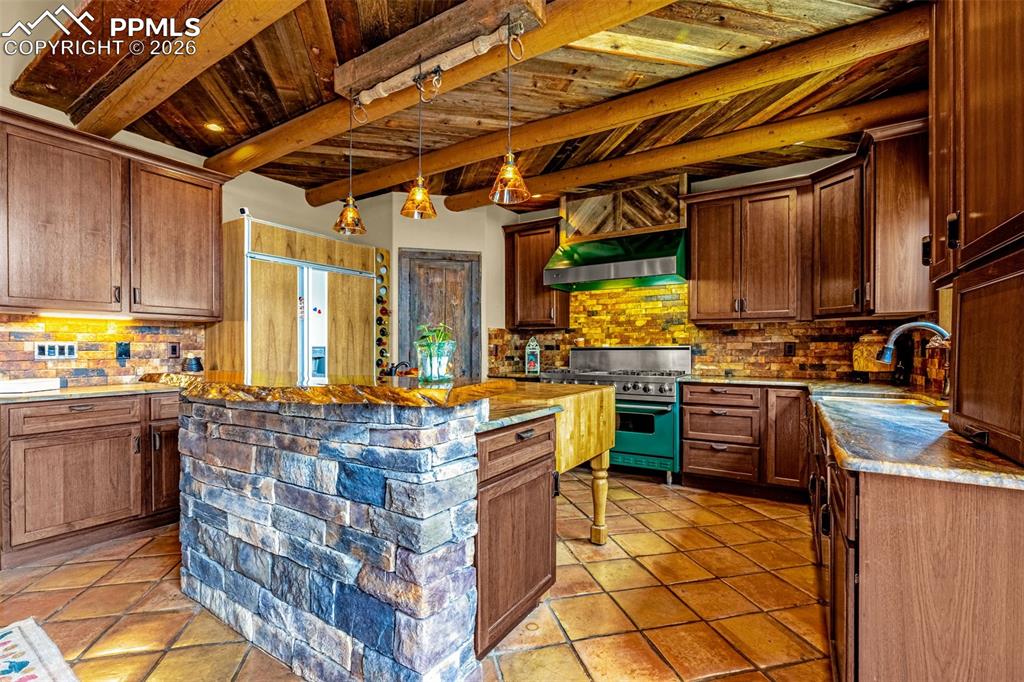 11960 Old Pueblo Road Fountain, CO 80817 - Photo 19 of 50 a kitchen with stainless steel appliances granite countertop a stove a sink and a microwave