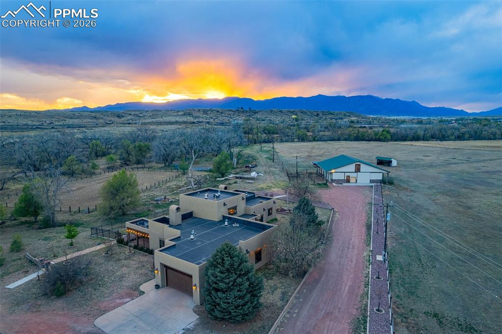 11960 Old Pueblo Road Fountain, CO 80817 - Photo 2 of 50 an aerial view of a house with pool and a yard