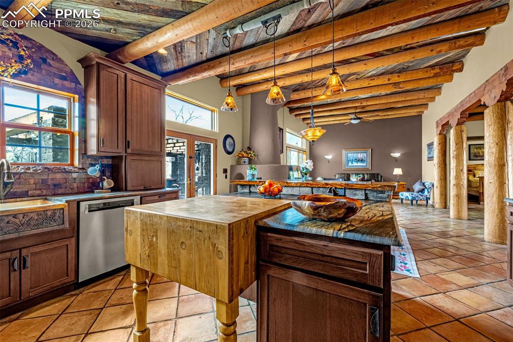 11960 Old Pueblo Road Fountain, CO 80817 - Photo 23 of 50 a kitchen with stainless steel appliances granite countertop a stove and cabinets
