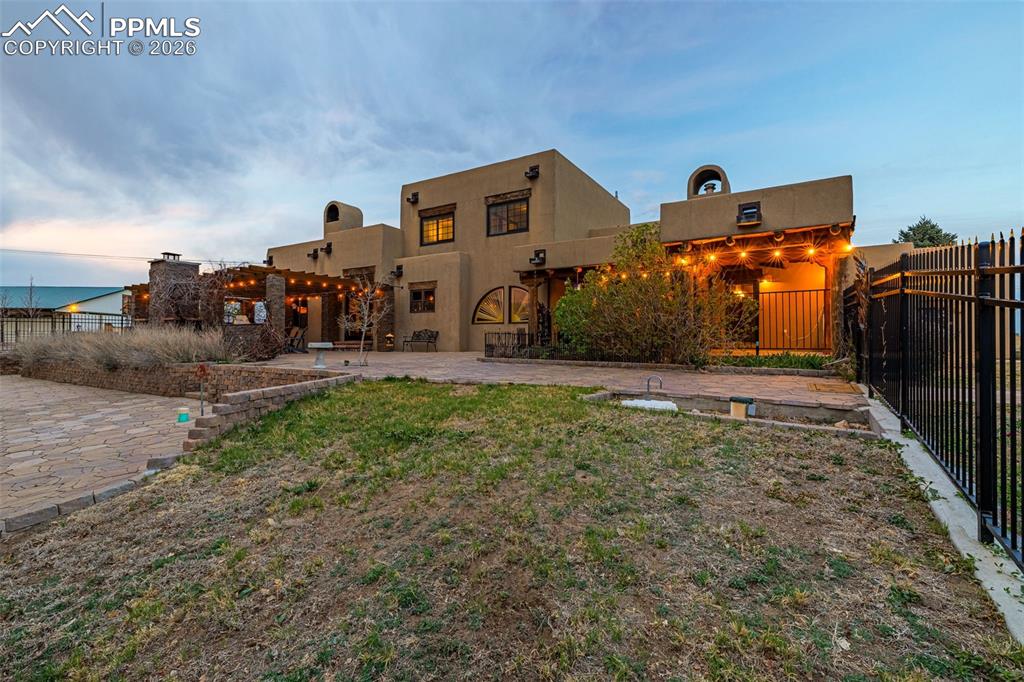 11960 Old Pueblo Road Fountain, CO 80817 - Photo 5 of 50 a front view of a house with a yard