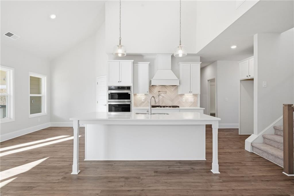 2540 Parkside Way Gainesville, GA 30507 - Photo 2 of 53 a view of kitchen with cabinets and wooden floor