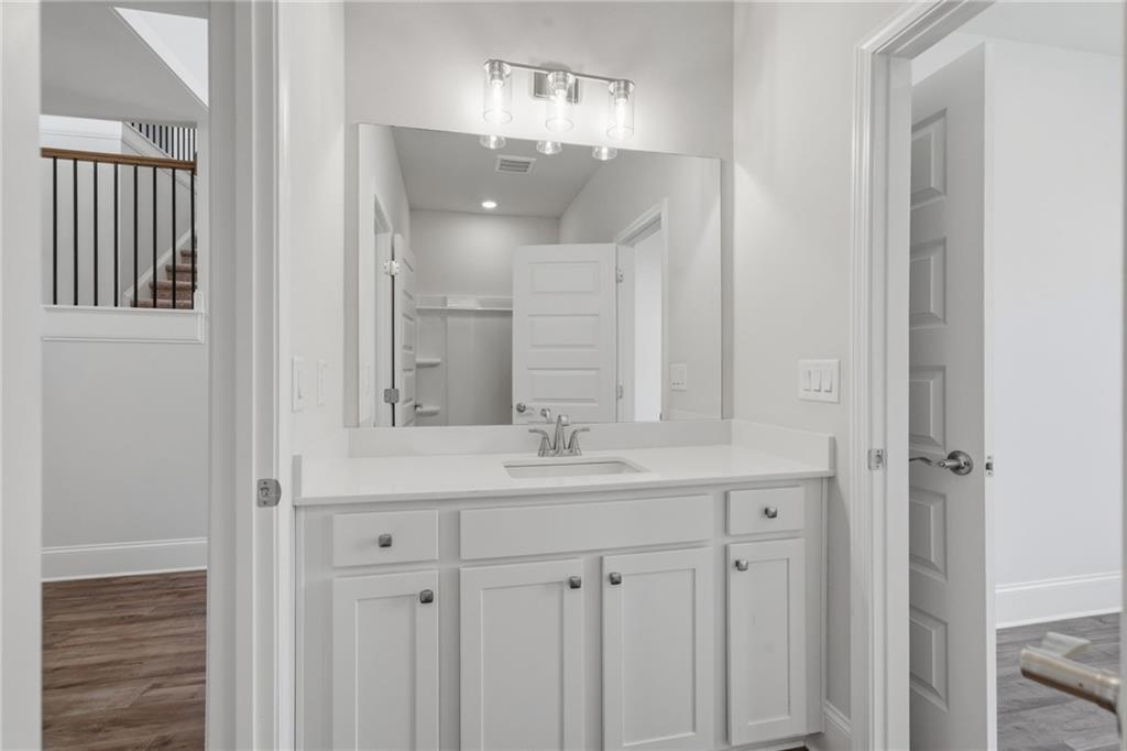2540 Parkside Way Gainesville, GA 30507 - Photo 23 of 53 a bathroom with a sink and a mirror