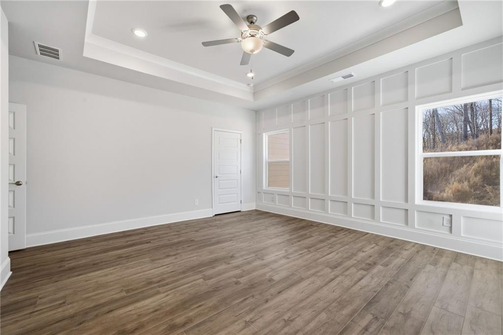 2540 Parkside Way Gainesville, GA 30507 - Photo 24 of 53 an empty room with wooden floor and windows