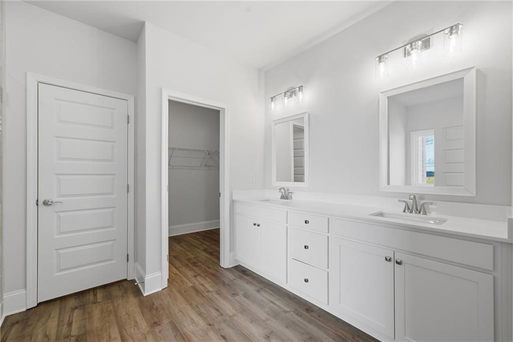 2540 Parkside Way Gainesville, GA 30507 - Photo 27 of 53 a spacious bathroom with double vanity a mirror and a shower