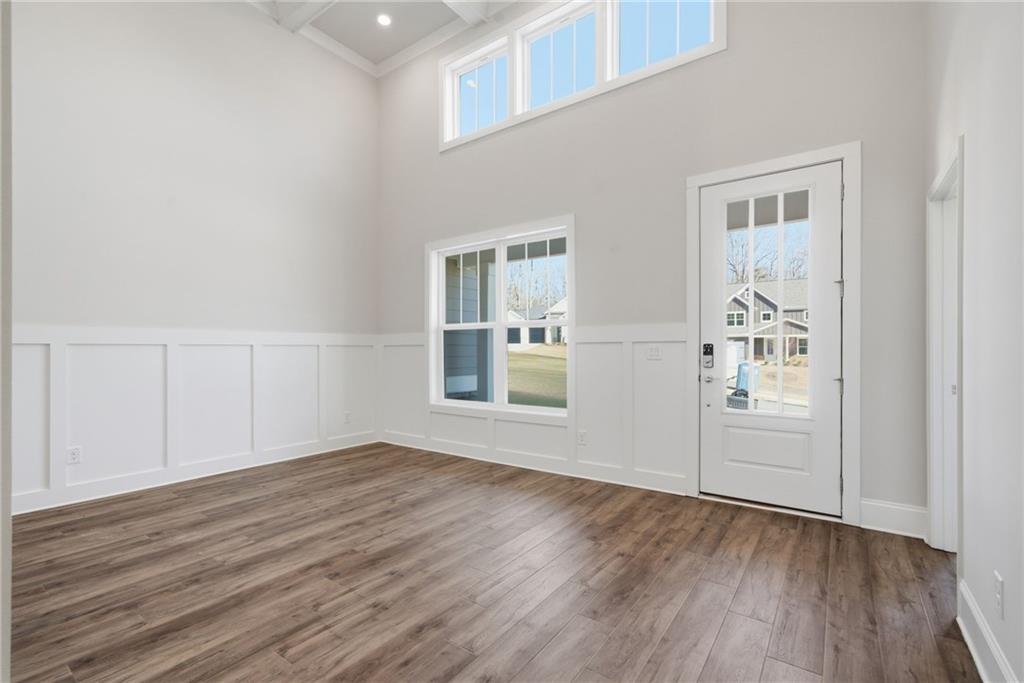 2540 Parkside Way Gainesville, GA 30507 - Photo 4 of 53 an empty room with wooden floor and windows