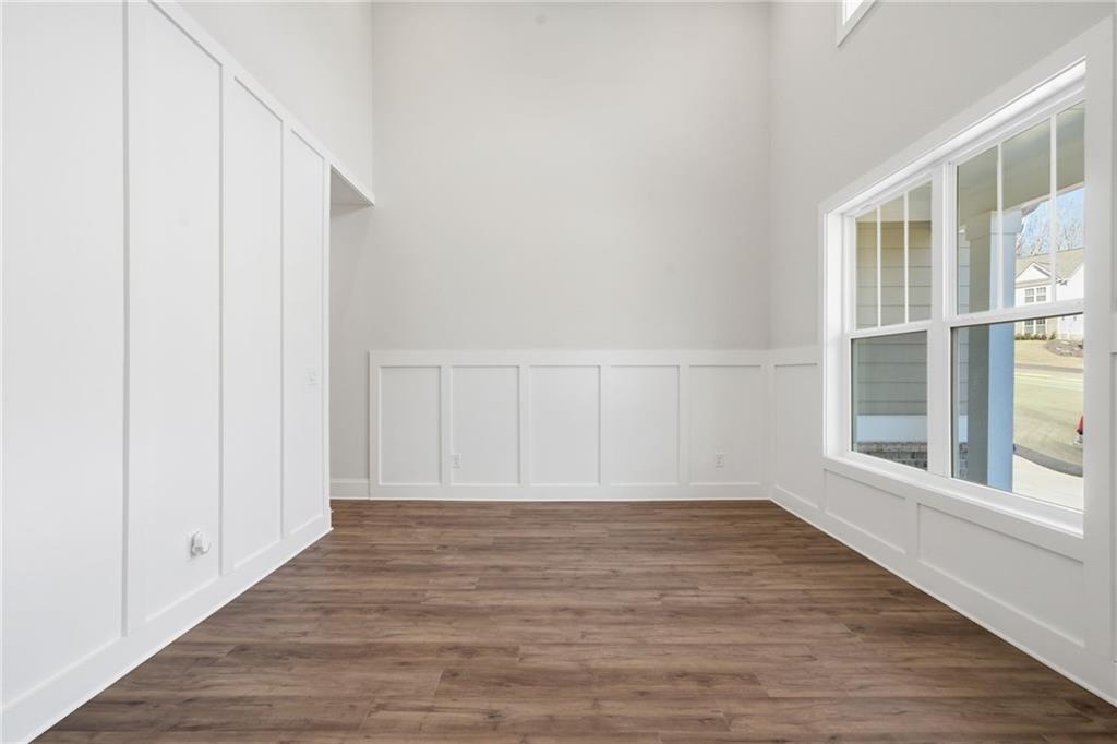 2540 Parkside Way Gainesville, GA 30507 - Photo 7 of 53 a view of an empty room with wooden floor and a window
