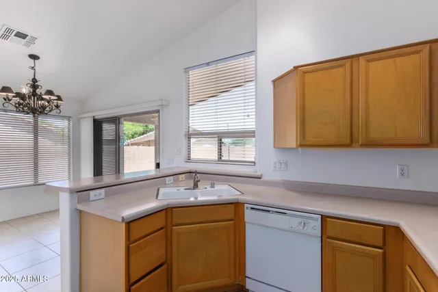 a kitchen with a sink and a window