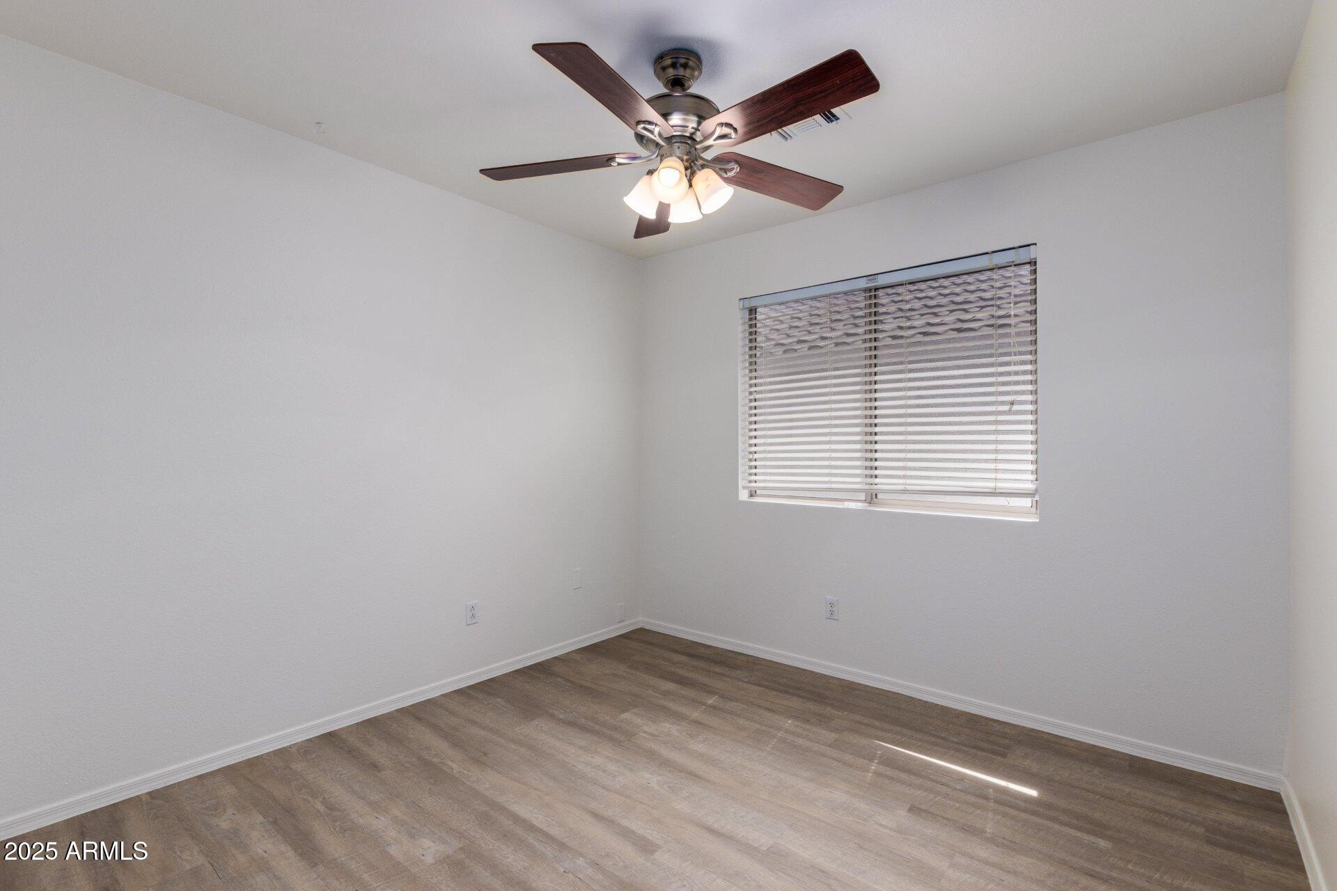 4443 East Rowel Road Phoenix, AZ 85050 - Photo 15 of 25 a view of an empty room with a window