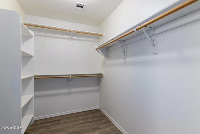 a view of an empty walk in closet