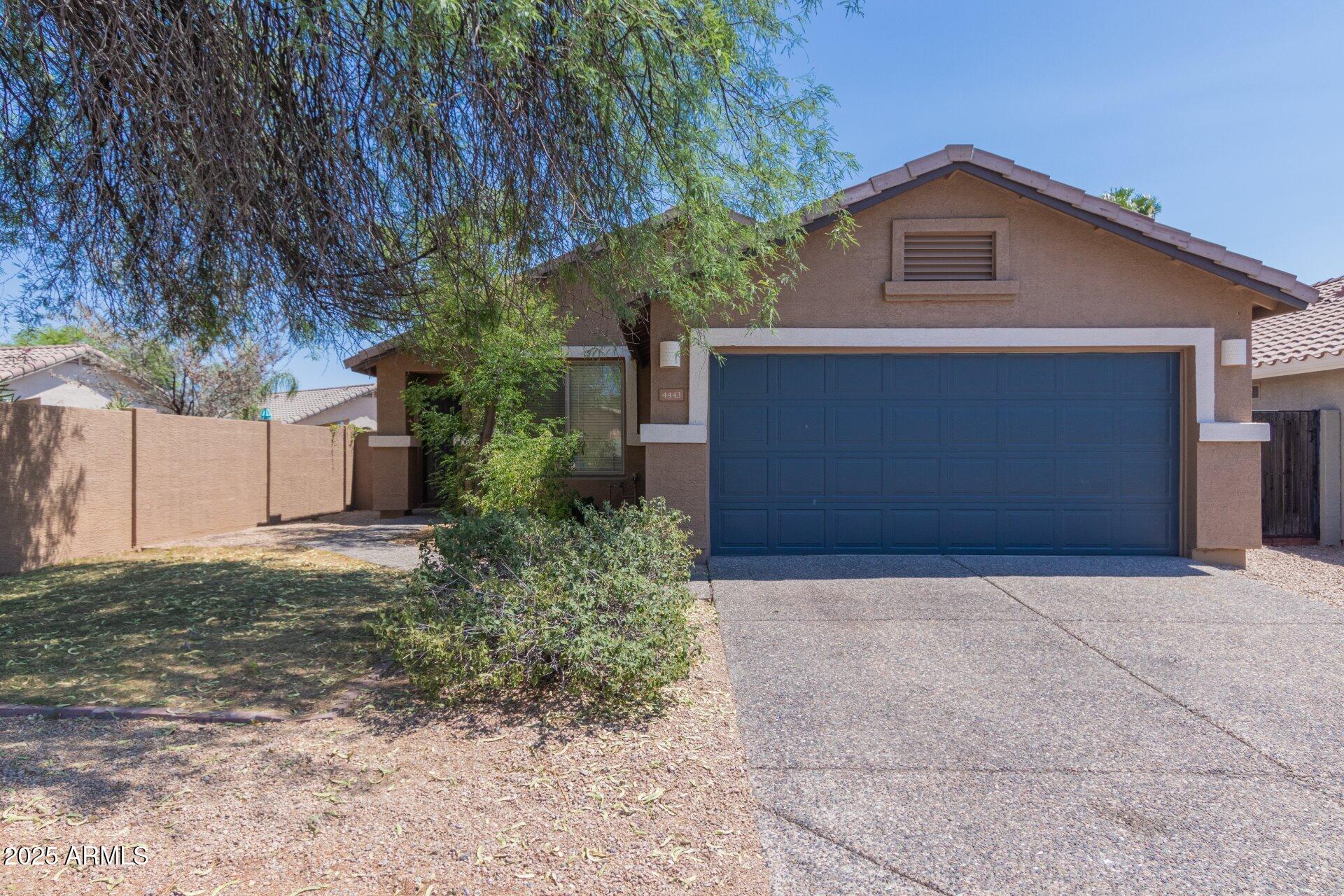 4443 East Rowel Road Phoenix, AZ 85050 - Photo 2 of 25 a front view of house with yard and trees