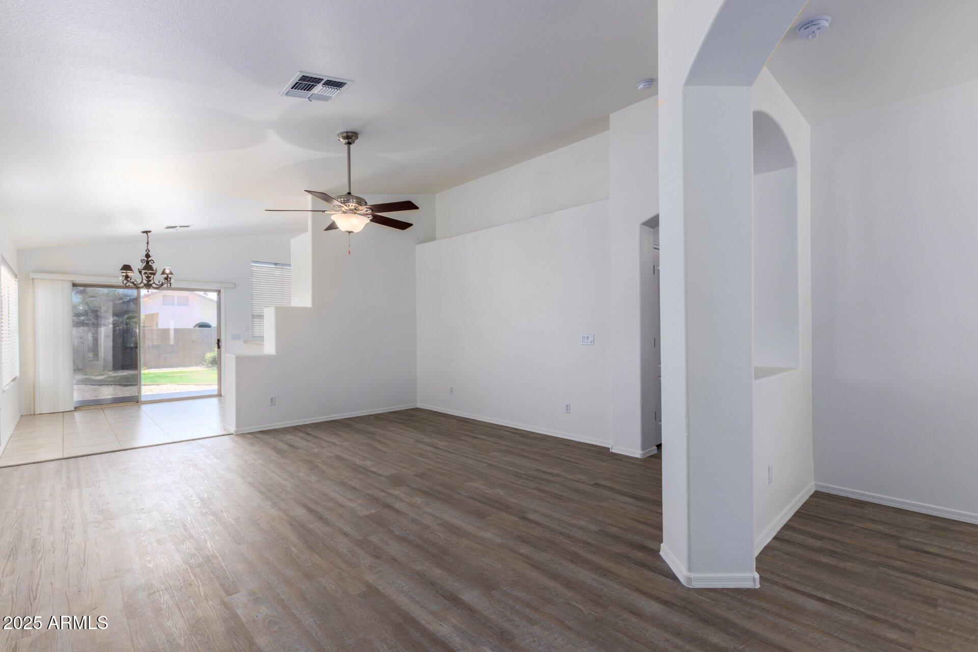 4443 East Rowel Road Phoenix, AZ 85050 - Photo 3 of 25 a view of a room with wooden floor