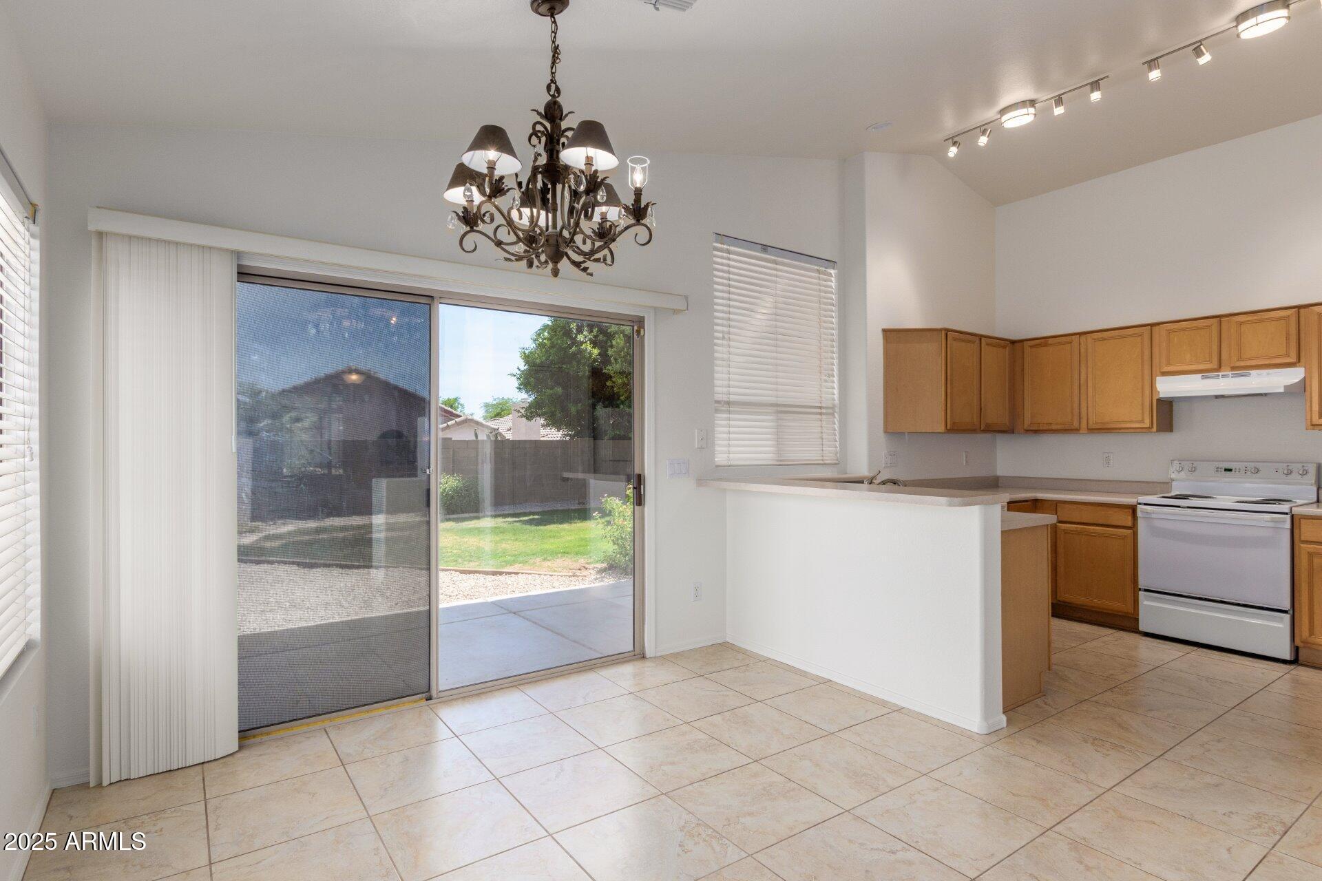 4443 East Rowel Road Phoenix, AZ 85050 - Photo 9 of 25 a view of a kitchen with a sink and refrigerator