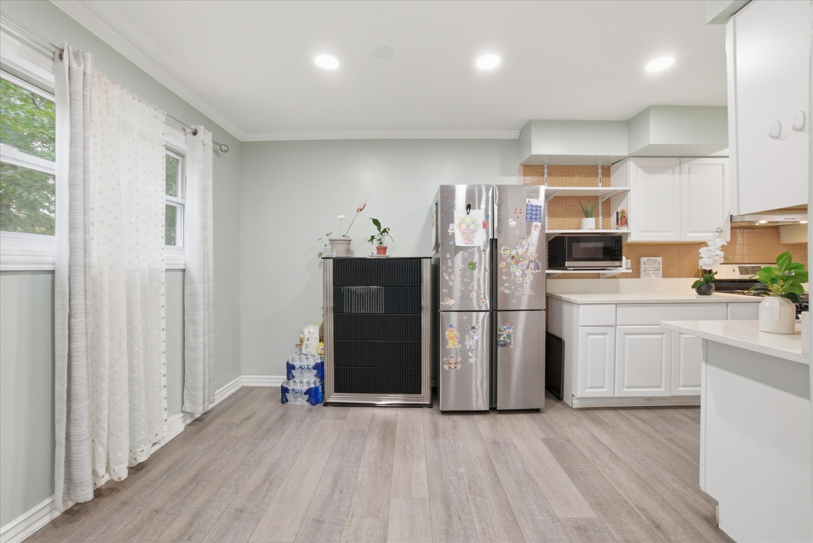 1582 Pennsylvania Avenue Des Plaines, IL 60018 - Photo 9 of 28 a kitchen with stainless steel appliances a refrigerator sink and microwave